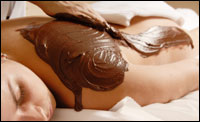 chocolate-massage Business that offer luxury goods and services are doing well with consumers who are cutting out big expenses but spending more on smaller indulgences, like chocolate body massages. iStockphoto.com