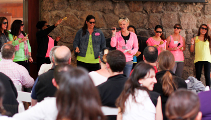 Jennifer Jhanda (in pink holding mic) brings her Admissions Team up with her to celebrate her 15th anniversary.
