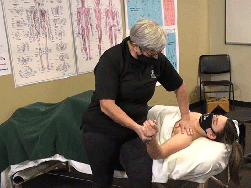 ANMT Program founder Cynthia Ribeiro providing neuromuscular therapy for back, neck and shoulder pain. 